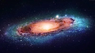 The Andromeda galaxy tilts across a pure black sky, its amber core fading into blue outer arms — the corners stay true black for OLED screens.