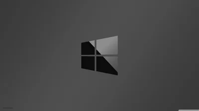 A two-tone window mark sits centred on a plain grey field, lit from the upper right and shaded on the left.