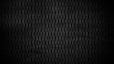 A fine woven mesh texture with a soft crease running through it, lit gently in the centre and vignetted heavily at every corner.
