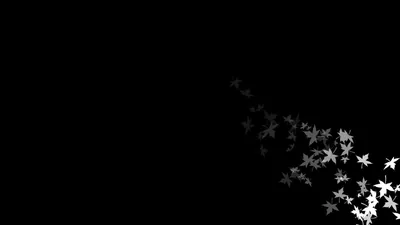 Small pale leaves drift in from the bottom right corner, thinning out toward the middle of an empty frame.