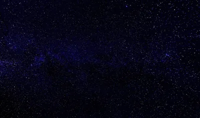 A very dark navy field where a slightly brighter band of stars runs across the middle, dim enough to leave room for icons anywhere.