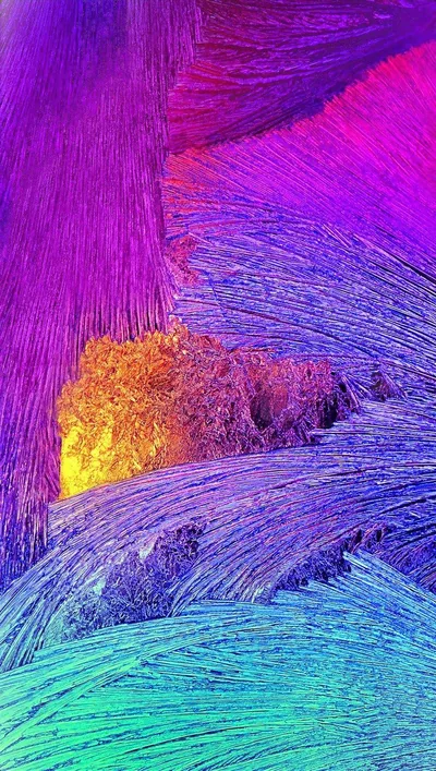Icy fiber strokes sweep from magenta at the top to violet and blue below, an amber flare burning left of centre; texture covers every corner.