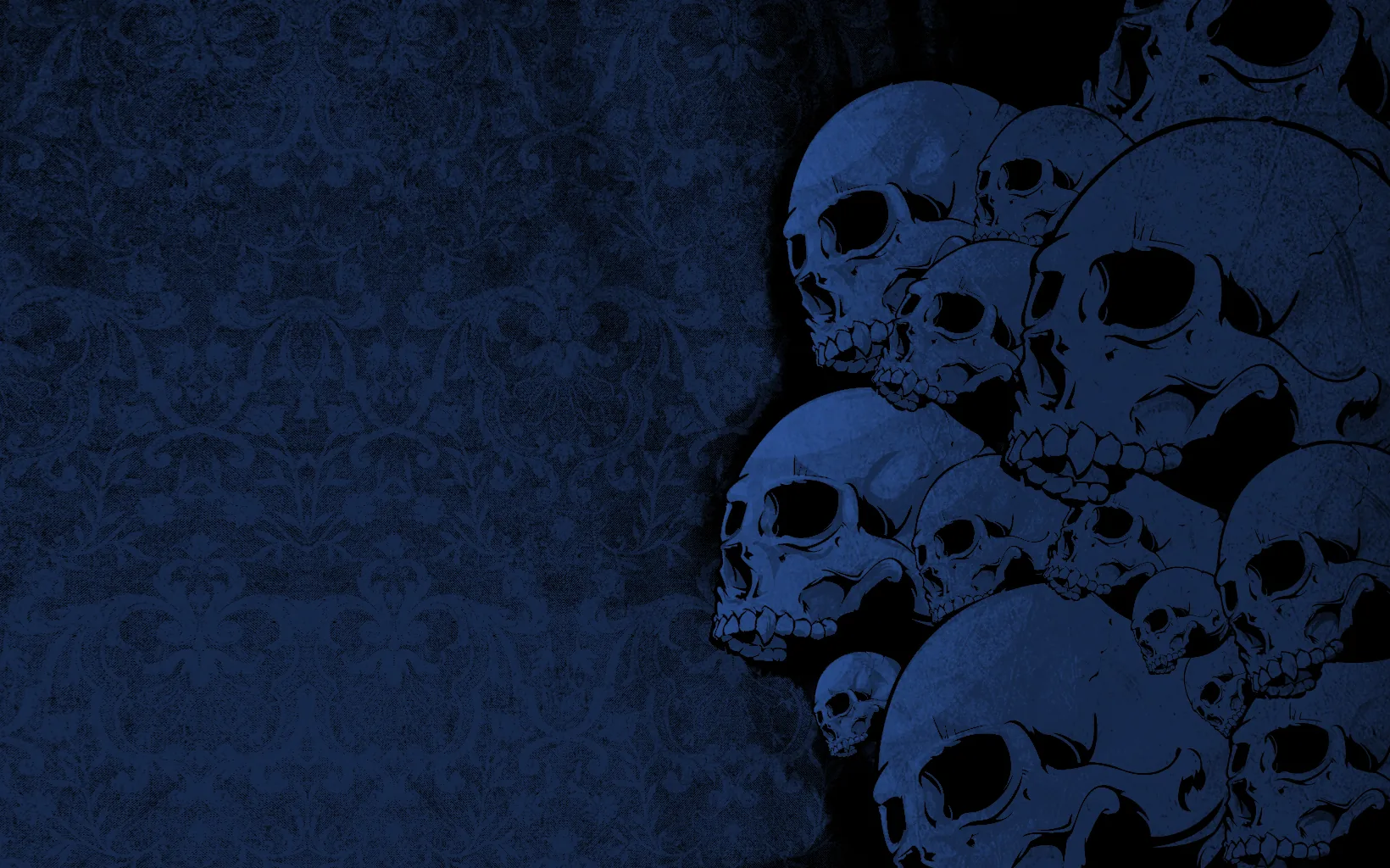 The same heap of skulls washed in deep navy, crowded to the right against a dim patterned wall that fades toward the left.