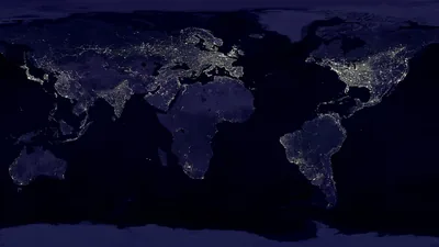 The whole flat map at night, continents traced only by their city lights — the US, Europe and Asia brightest — over oceans of near-black for OLED.
