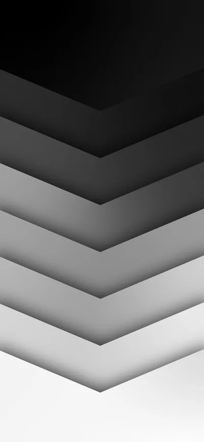 Wide chevrons stack down the frame, stepping from solid black at the top to pale grey and white at the bottom.