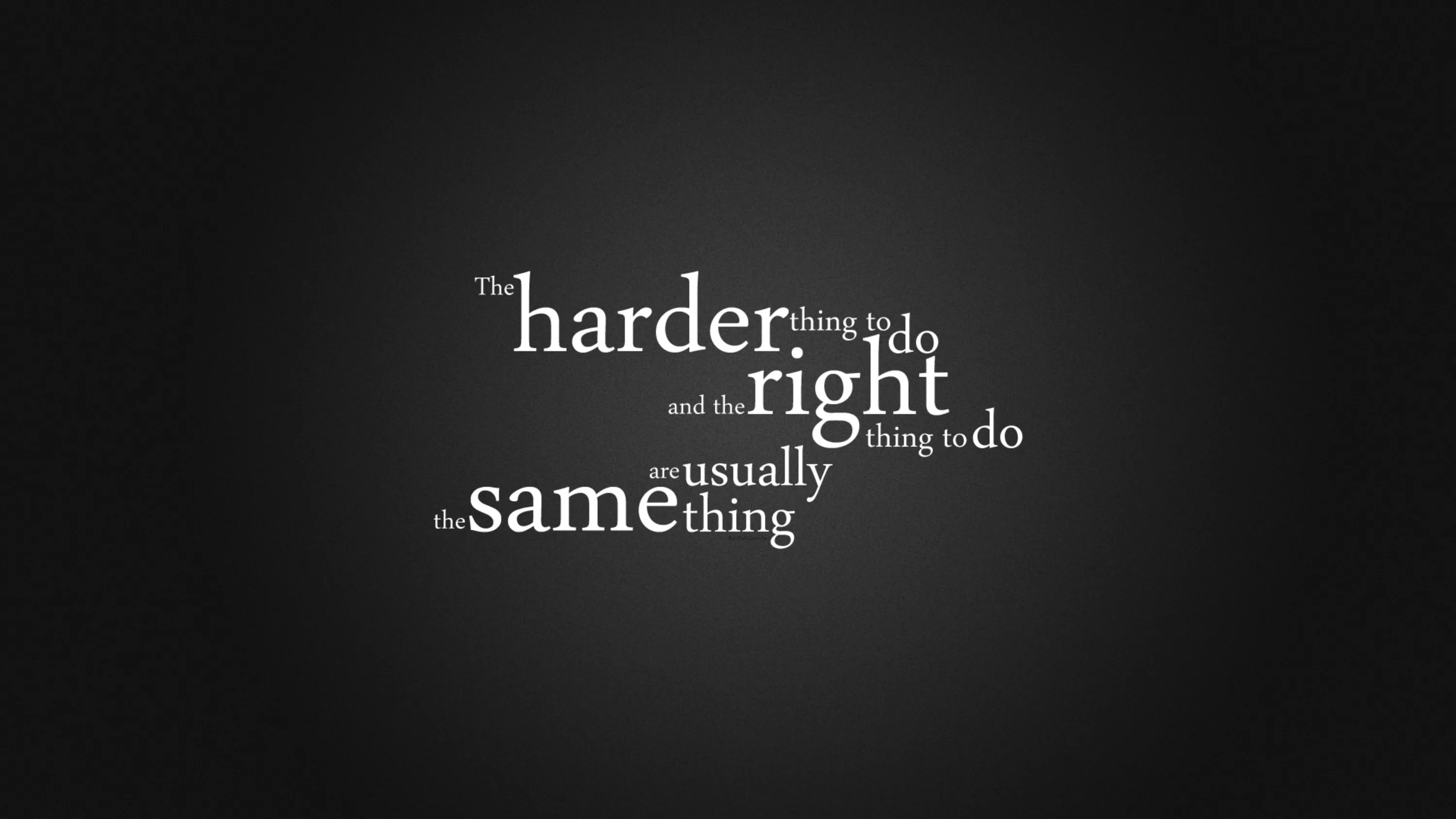 A short line of type set in mixed weights fills the centre of a soft grey-to-black backdrop.