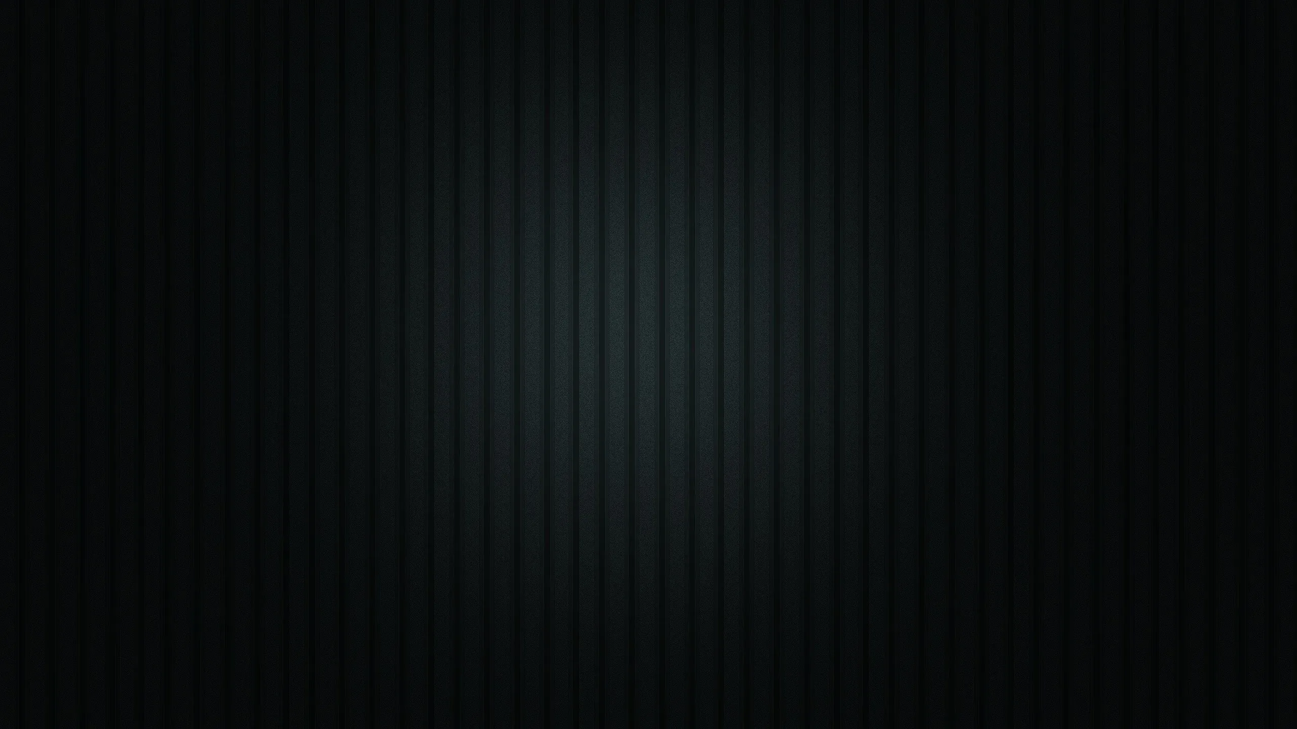 Thin vertical strips run the full height of a near-black panel, a faint cool glow behind them lifting the centre just enough to read as texture.