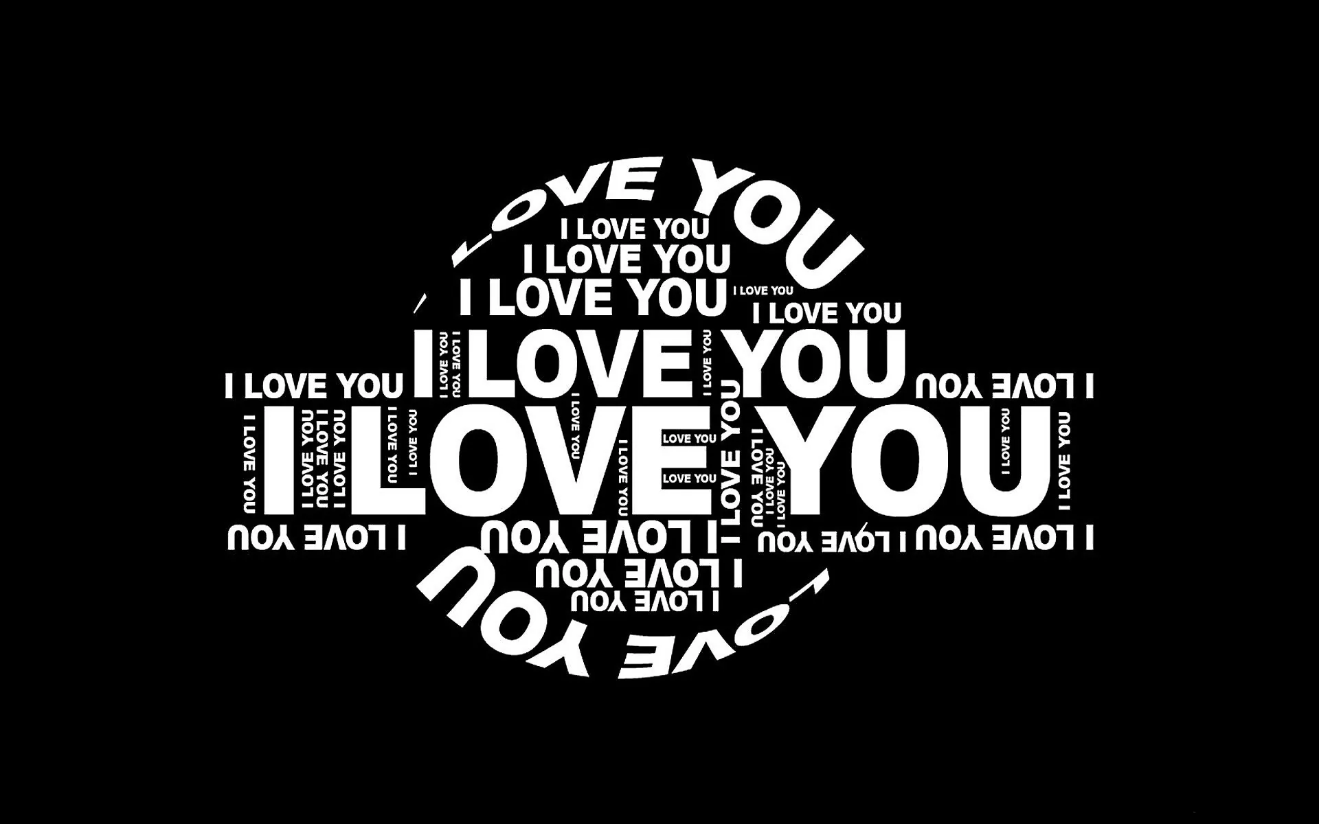 The phrase I Love You repeats at shifting sizes in white type, the block of words cut into the shape of a heart.