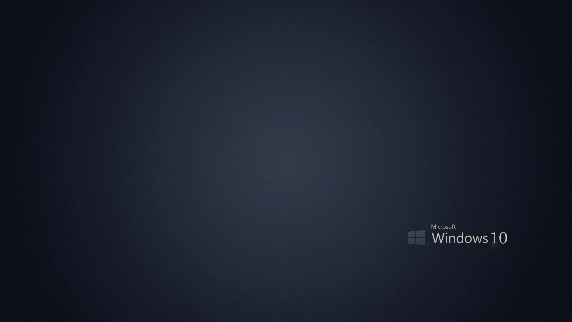 A smooth dark navy field fills the frame with the small Microsoft Windows 10 wordmark set low in the right corner, the rest left clear.