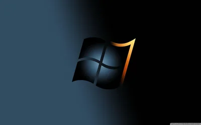 The Windows flag rendered in dark blue with a gold ribbon curling from its upper right, set on a deep navy-to-black gradient.