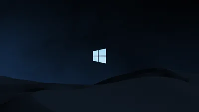 A small bright window mark hangs above smooth blue-black dunes that roll along the bottom of the frame.