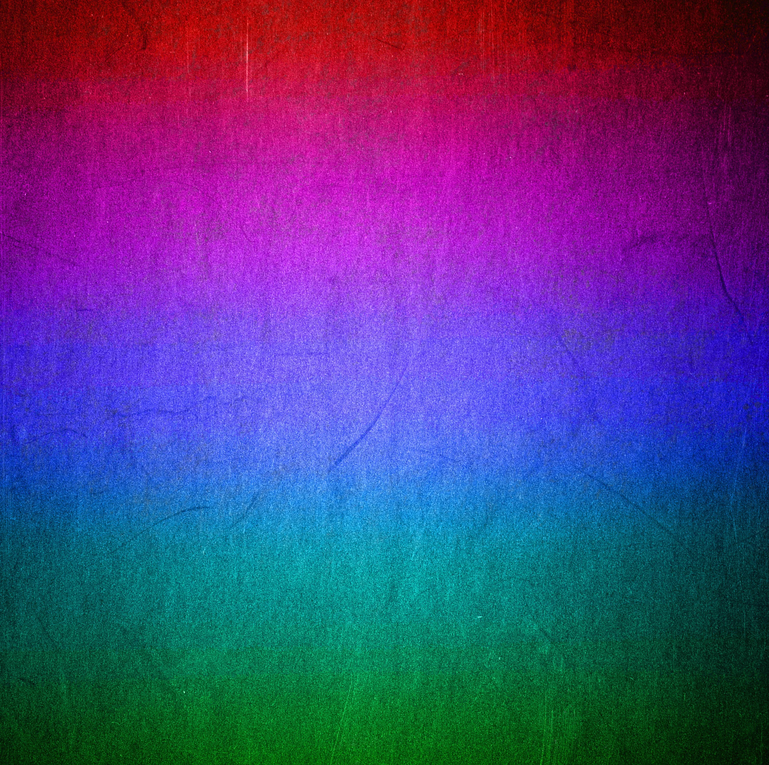 Horizontal bands of red, magenta, blue and green blend over a fibrous paper-like texture, thin creases showing through the colour.
