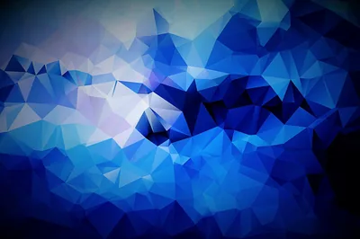 Hundreds of flat triangles tile the frame in navy and cobalt, with a pale patch near the upper left where the light seems to come from.