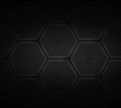 Large hexagon plates sit edge to edge, each one punched with a grid of tiny holes and separated by thin recessed lines.
