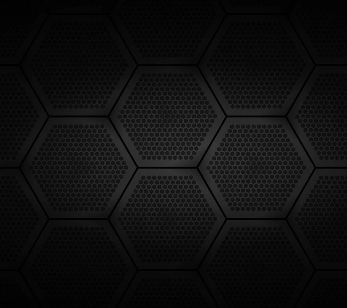 Large hexagon plates sit edge to edge, each one punched with a grid of tiny holes and separated by thin recessed lines.