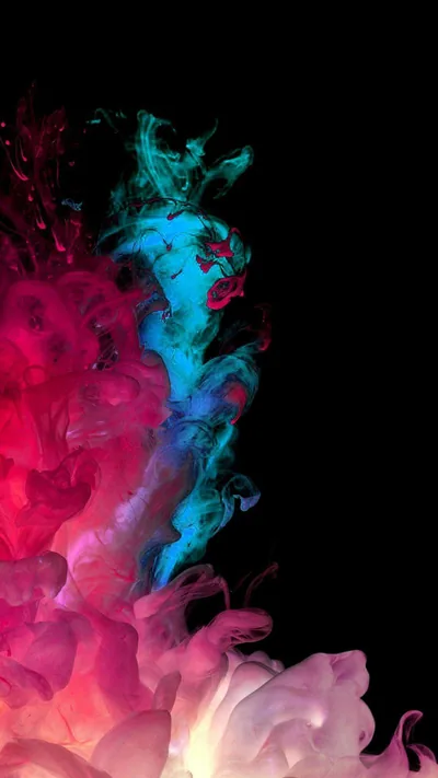 Clouds of magenta and cyan ink billow up from the bottom left corner and curl into each other, the top right left completely black.