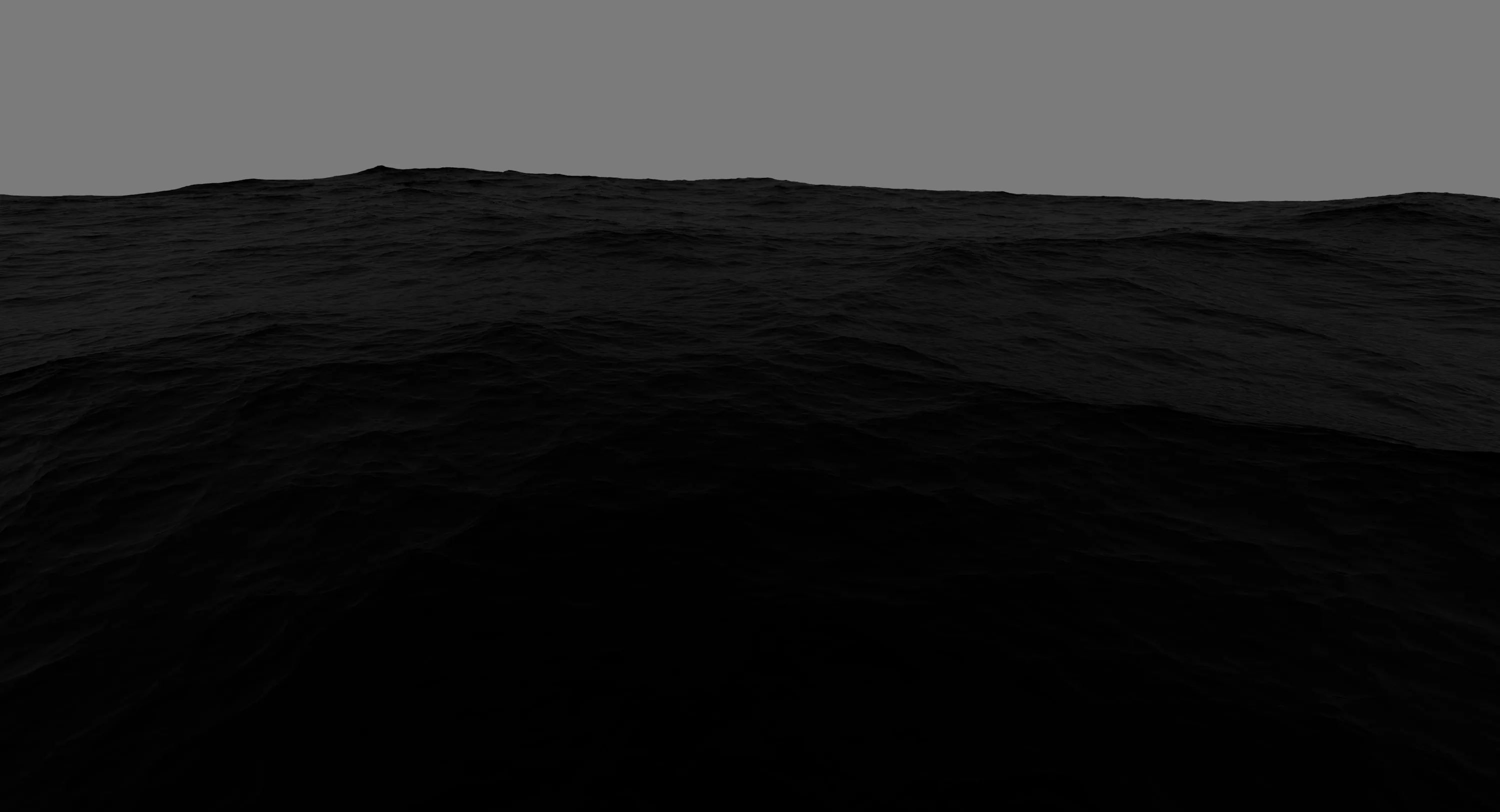 Almost-black water rolls under a narrow band of grey sky, the only light sitting along the horizon line.