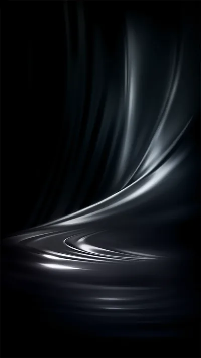 Fabric ripples across the lower half in soft waves, a few strands of silver light running along the crests while the top stays dark.