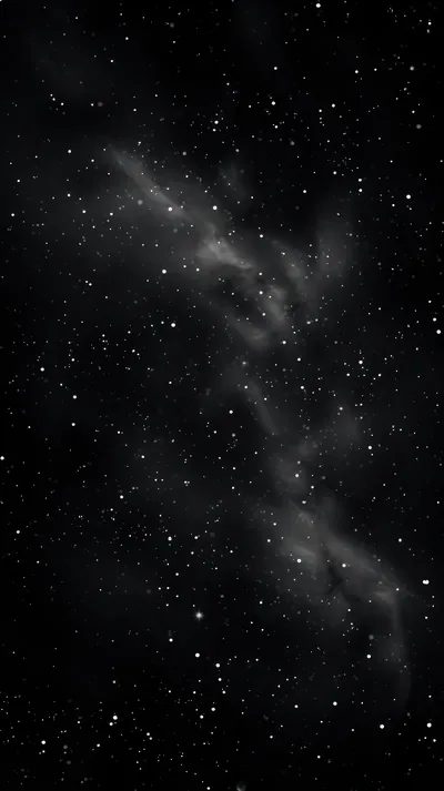 A pale band of nebula gas runs corner to corner down a tall black frame, pinpoint stars scattered thinly on either side of it.