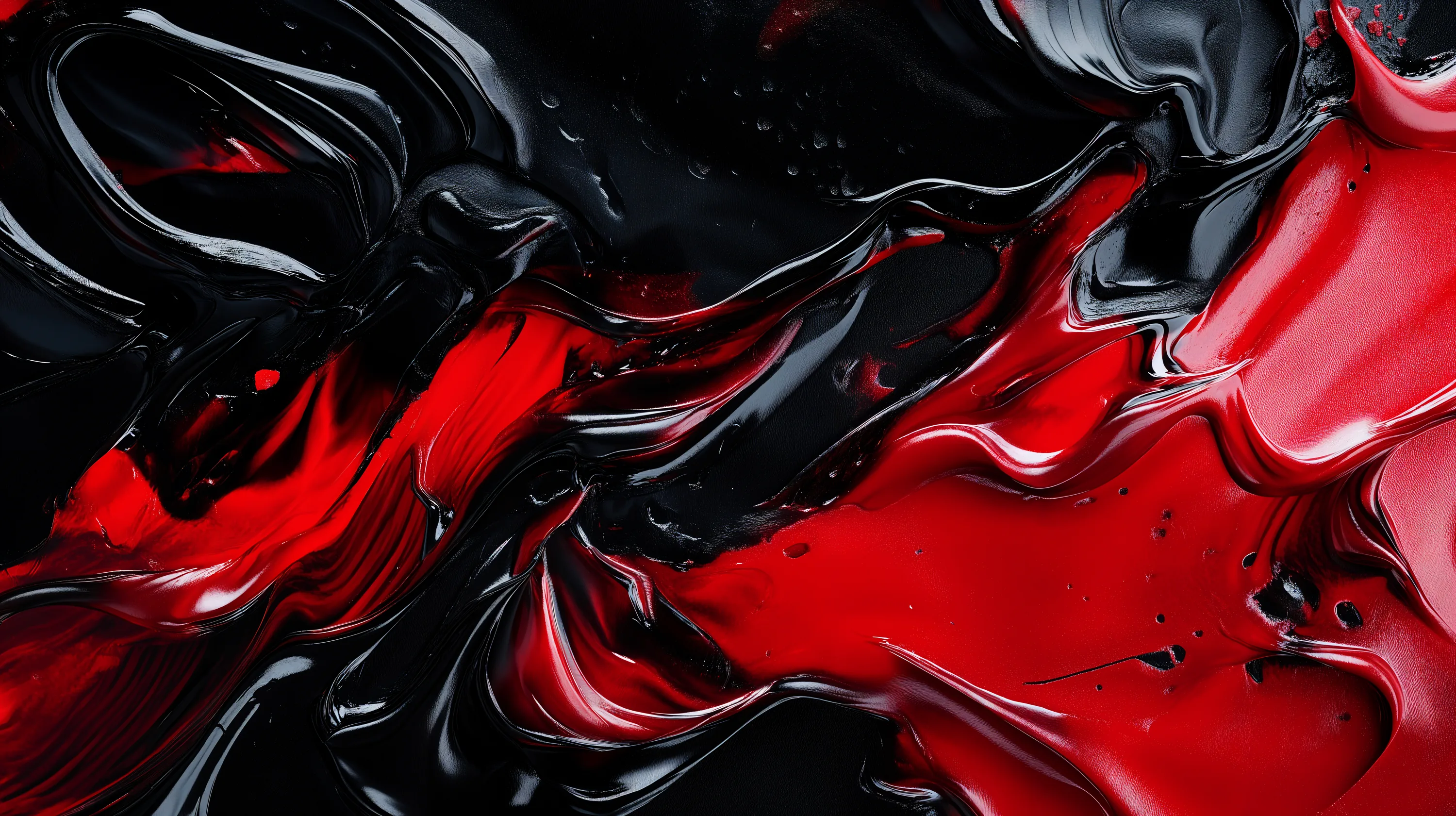 Red and black paint poured together and shot close, the surface still wet enough to hold a reflection along every ridge.