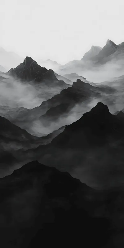 Ridge behind ridge fades into fog in flat grey tones, the nearest peaks almost black at the bottom of the frame.