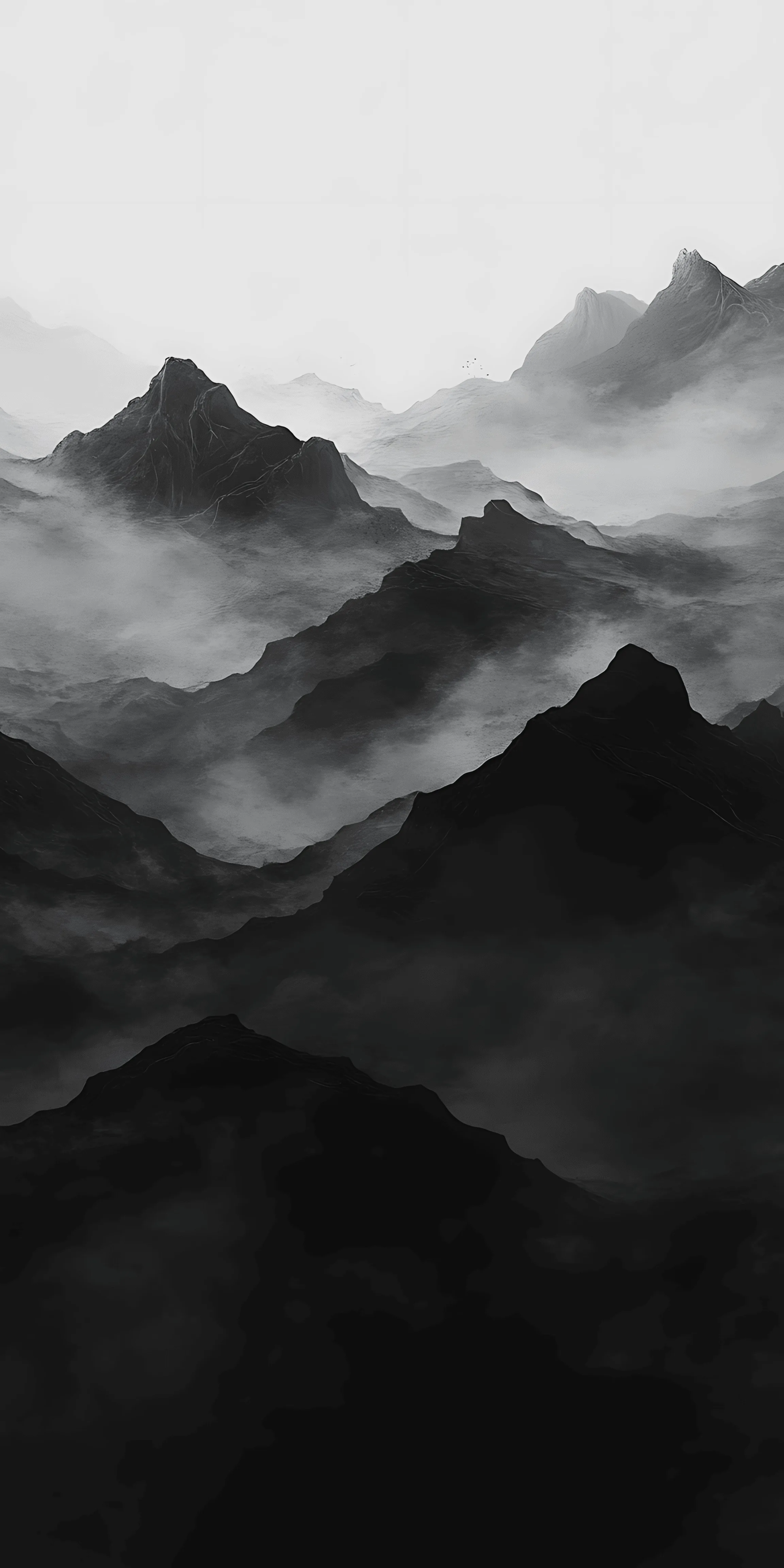 Ridge behind ridge fades into fog in flat grey tones, the nearest peaks almost black at the bottom of the frame.