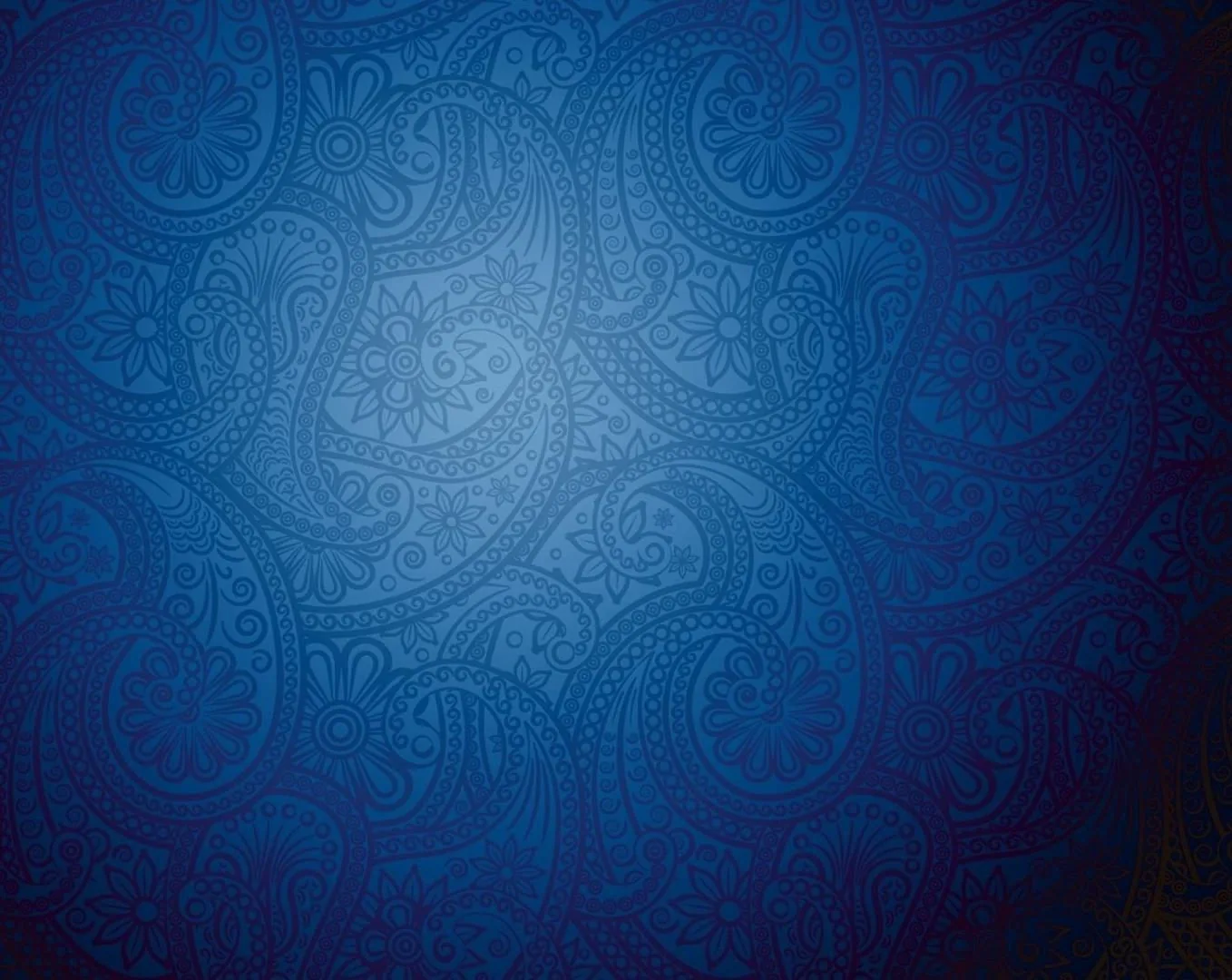 Engraved paisley medallions cover a royal-blue ground that brightens at dead centre, the bottom-right corner falling darkest so a dock disappears into it.