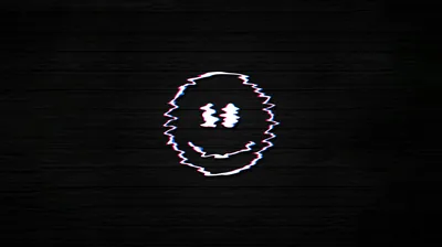 A crude smiley drawn in white surfaces at the centre of a dark brick wall, its outline torn apart by horizontal glitch distortion.