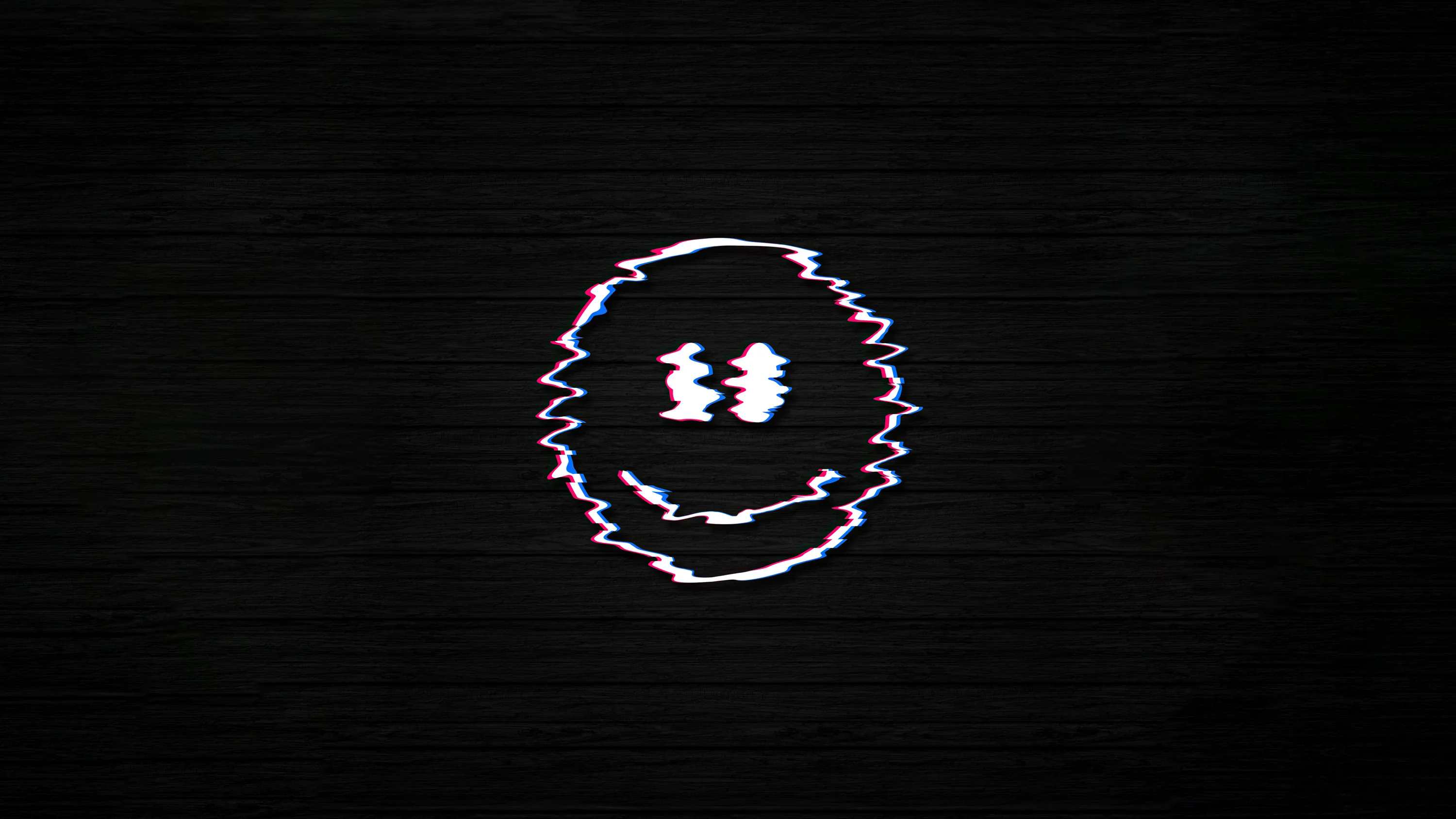 A crude smiley drawn in white surfaces at the centre of a dark brick wall, its outline torn apart by horizontal glitch distortion.