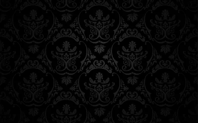 An ornate damask motif tiles the frame in barely-lighter charcoal, even from corner to corner.