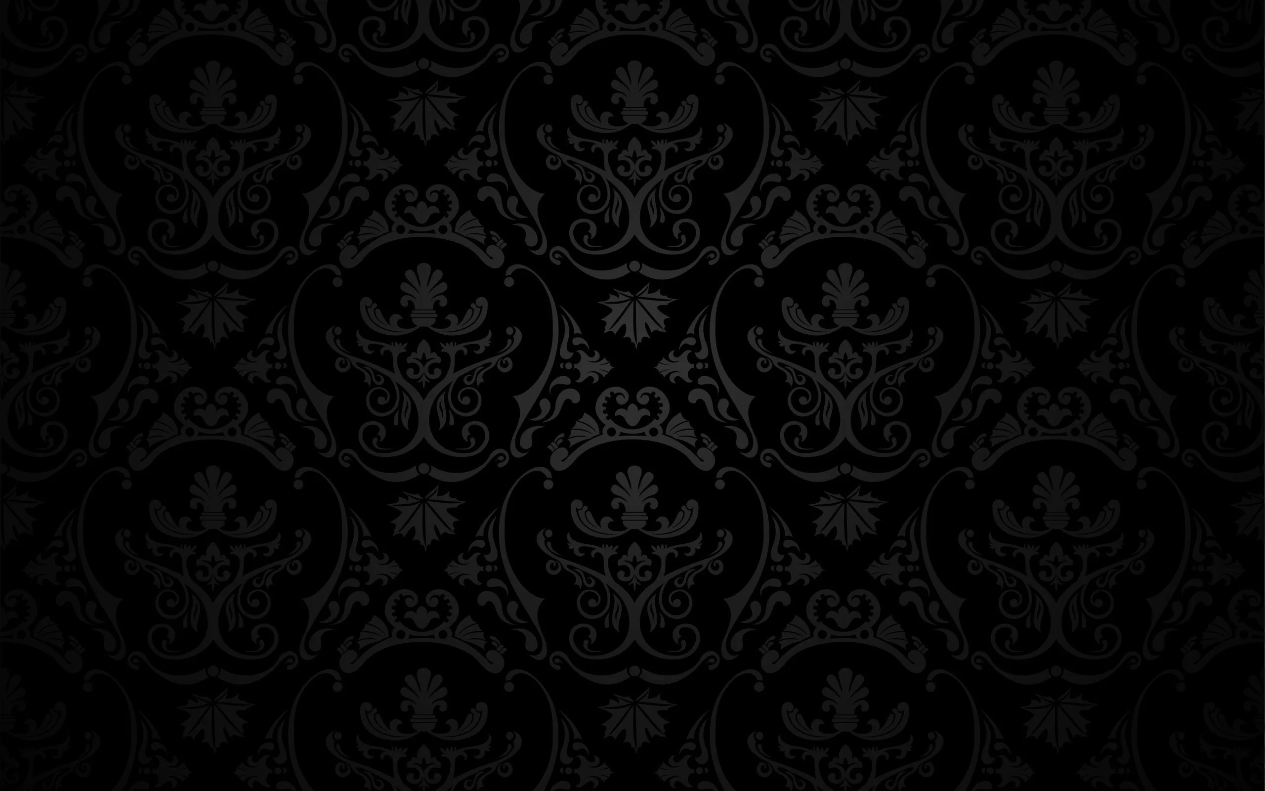 An ornate damask motif tiles the frame in barely-lighter charcoal, even from corner to corner.