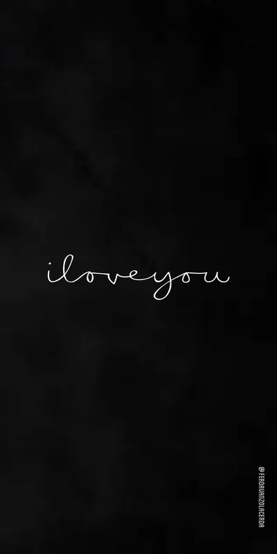 Thin white cursive reading i love you sits centred on a softly textured charcoal wall, wide empty space above and below it.