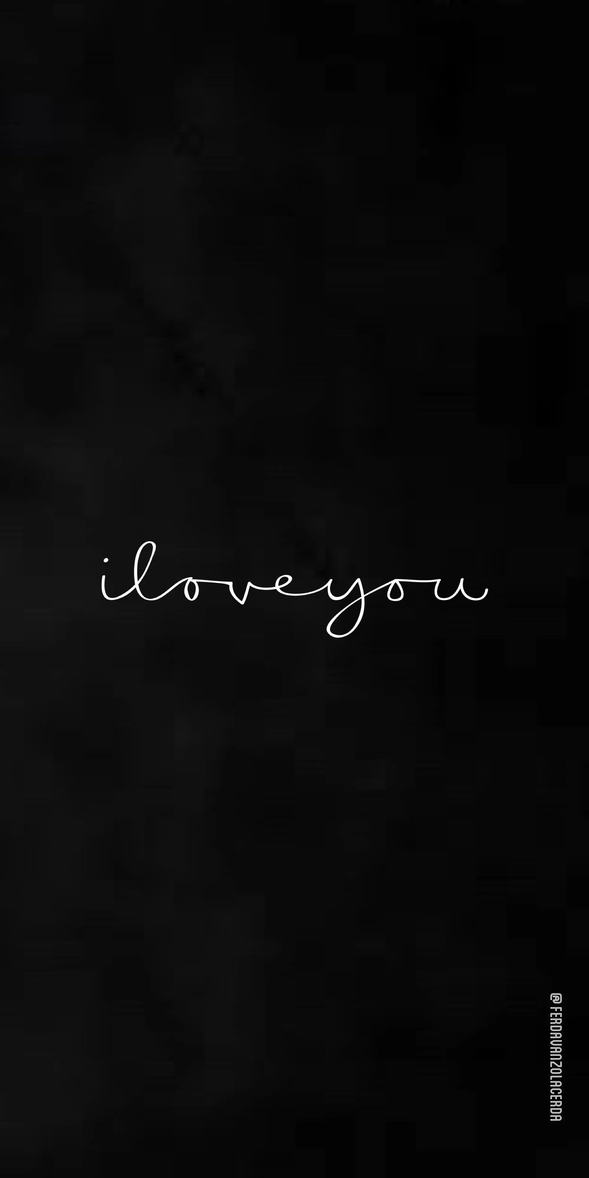 Thin white cursive reading i love you sits centred on a softly textured charcoal wall, wide empty space above and below it.