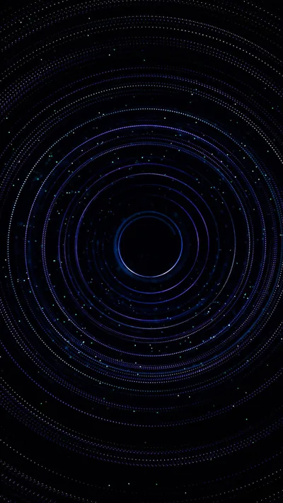 Concentric rings of blue particles orbit a dark centre, the dust thinning outward until it disappears into the black of the frame.