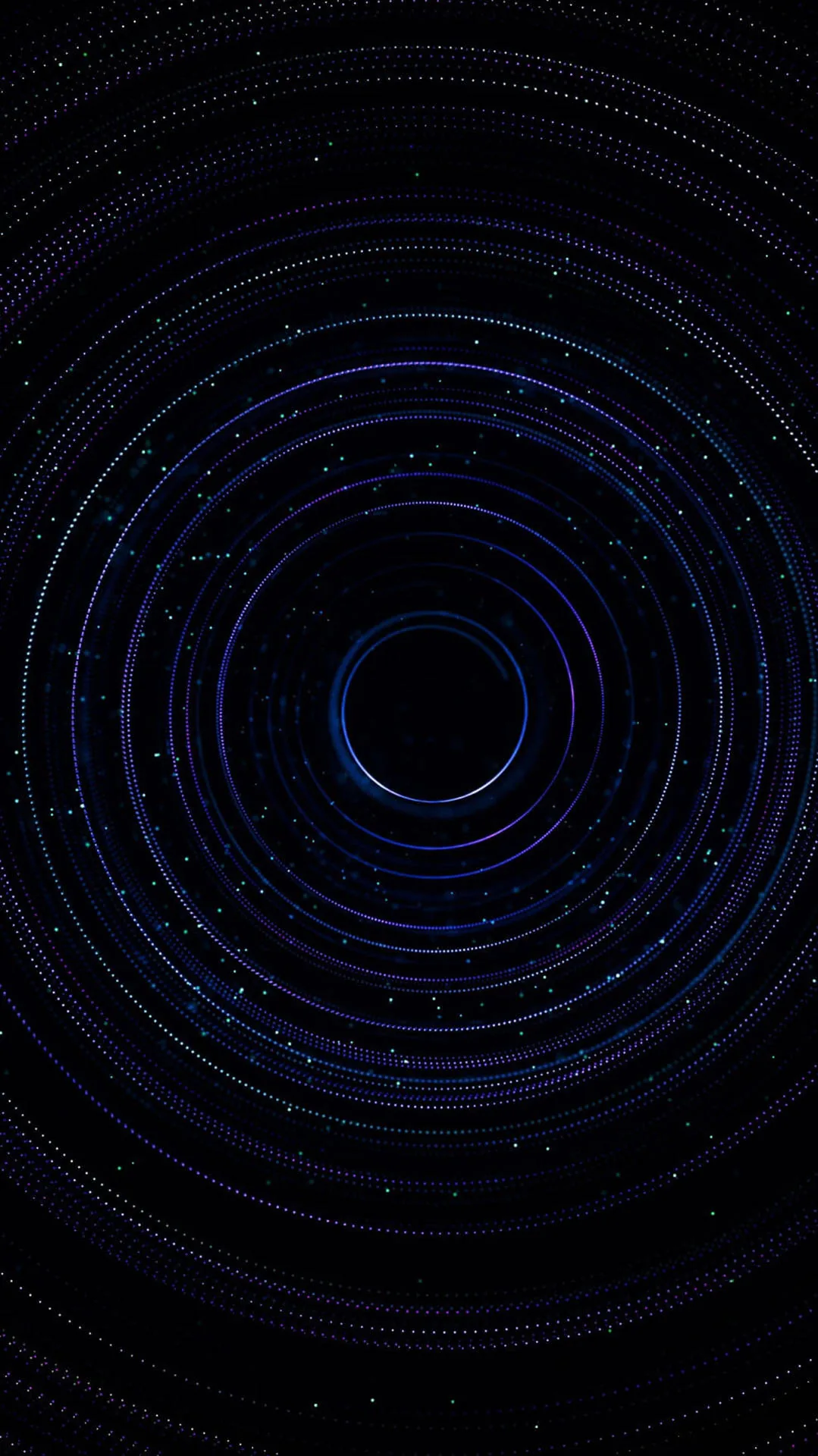 Concentric rings of blue particles orbit a dark centre, the dust thinning outward until it disappears into the black of the frame.
