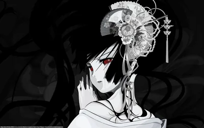 A fan-shaped silver ornament sits above her ear as black hair spills across the frame, her red eyes the only warmth in the monochrome.