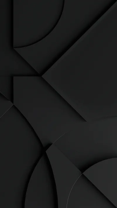 Flat black panels overlap with wide circular cutouts, the shapes readable only through the soft shadows between them.