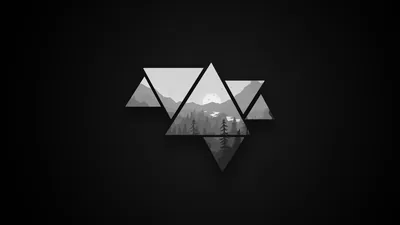 Three triangles arranged in a cluster hold a misty mountain photo inside them, set on a dark grey field.