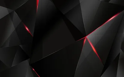 Angular black facets tile the surface while red light burns along a few of the cracks, strongest in the upper left and lower right.