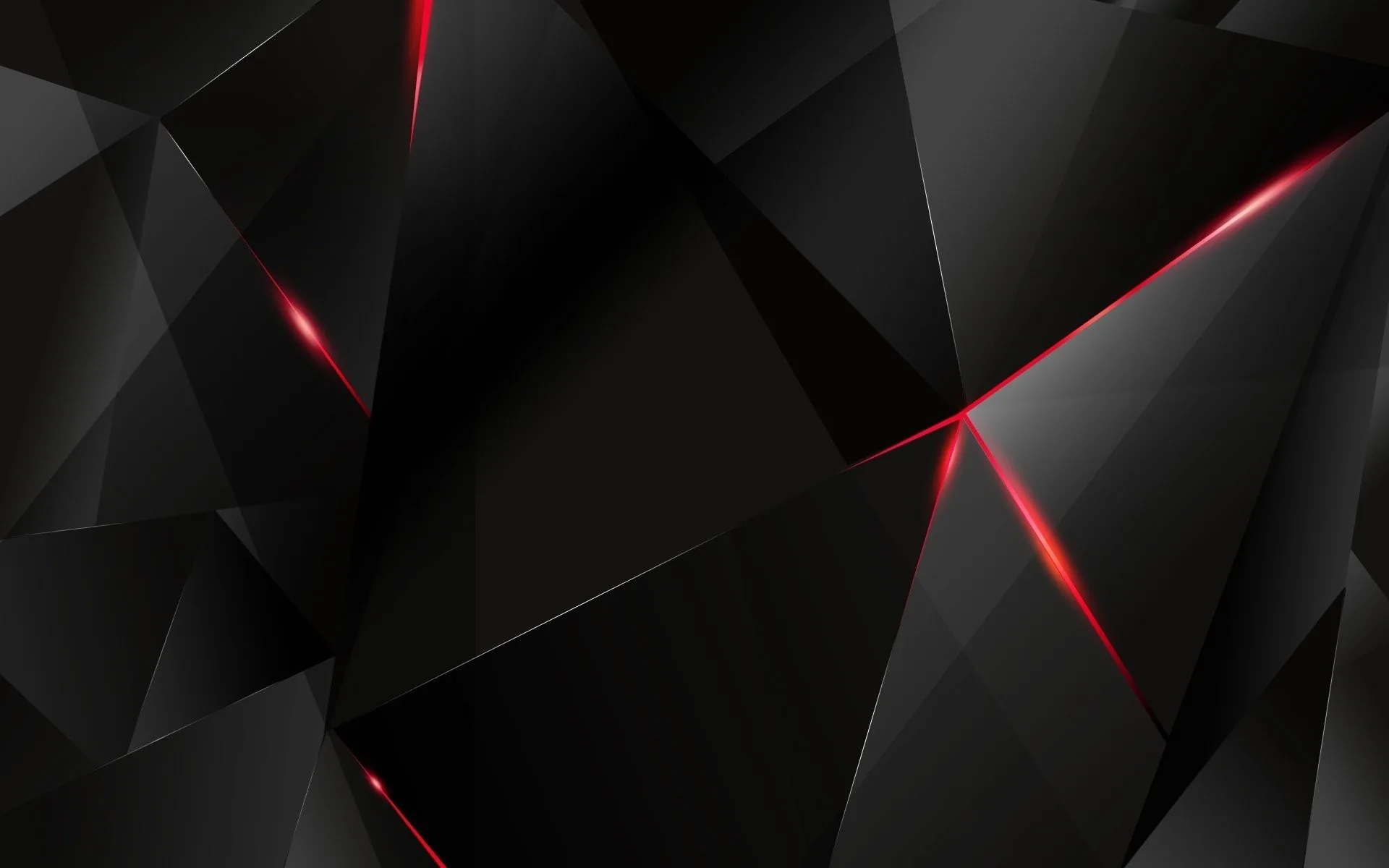 Faceted dark planes fill the frame, thin red light burning along the cracks where they meet.