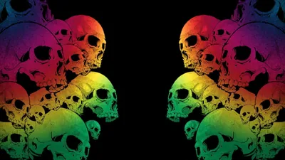 Two matching stacks of skulls face each other across a black gap down the centre, each one washed in a red-to-green rainbow gradient.