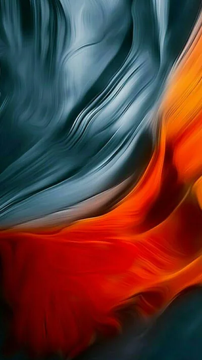 Slate blue silk folds fill the upper left while orange-red fabric surges up from the lower right, the two meeting along a soft diagonal seam.