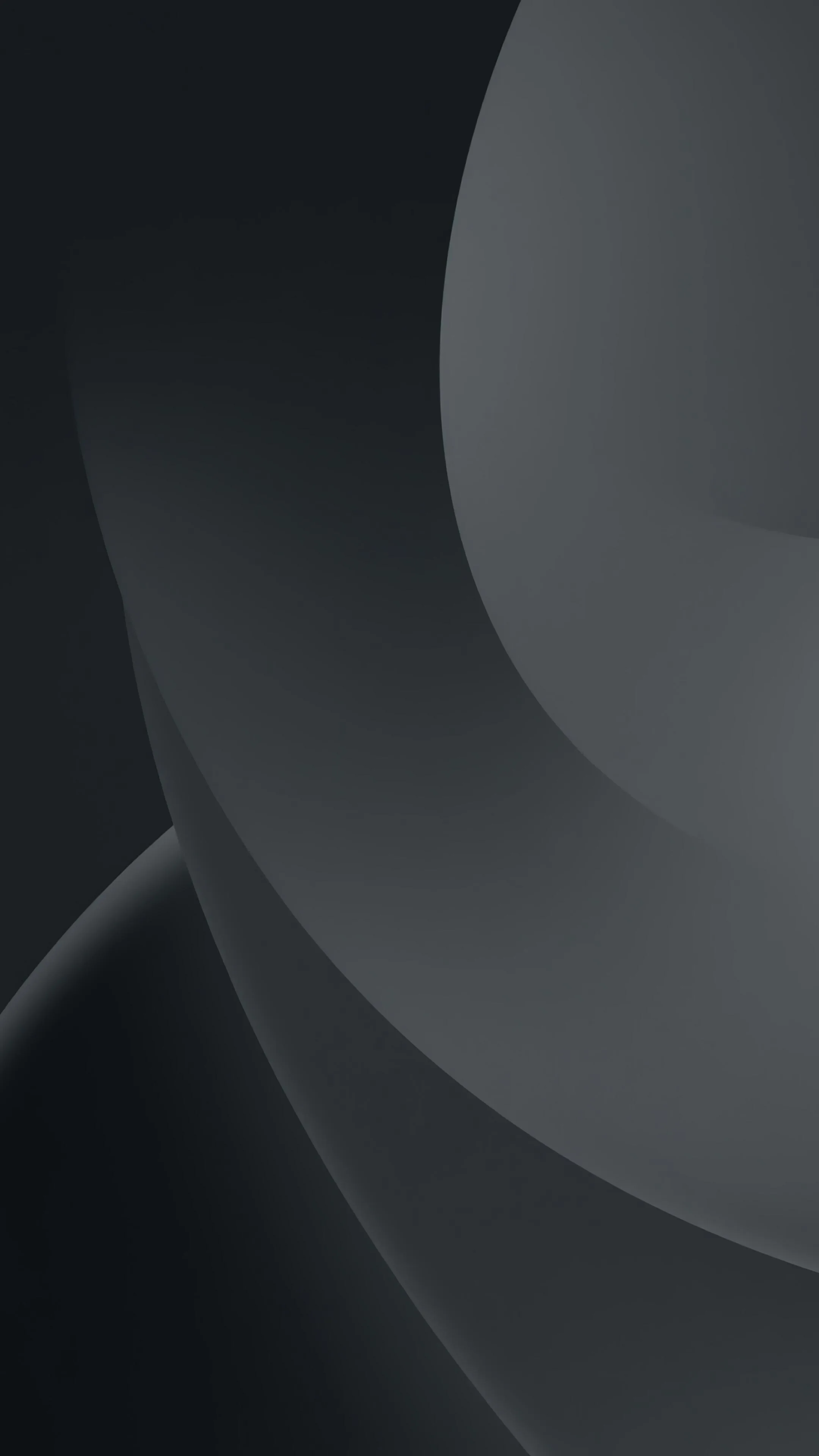 Two broad circular edges sweep through the frame in slightly different greys, the top left corner left dark and uncluttered.