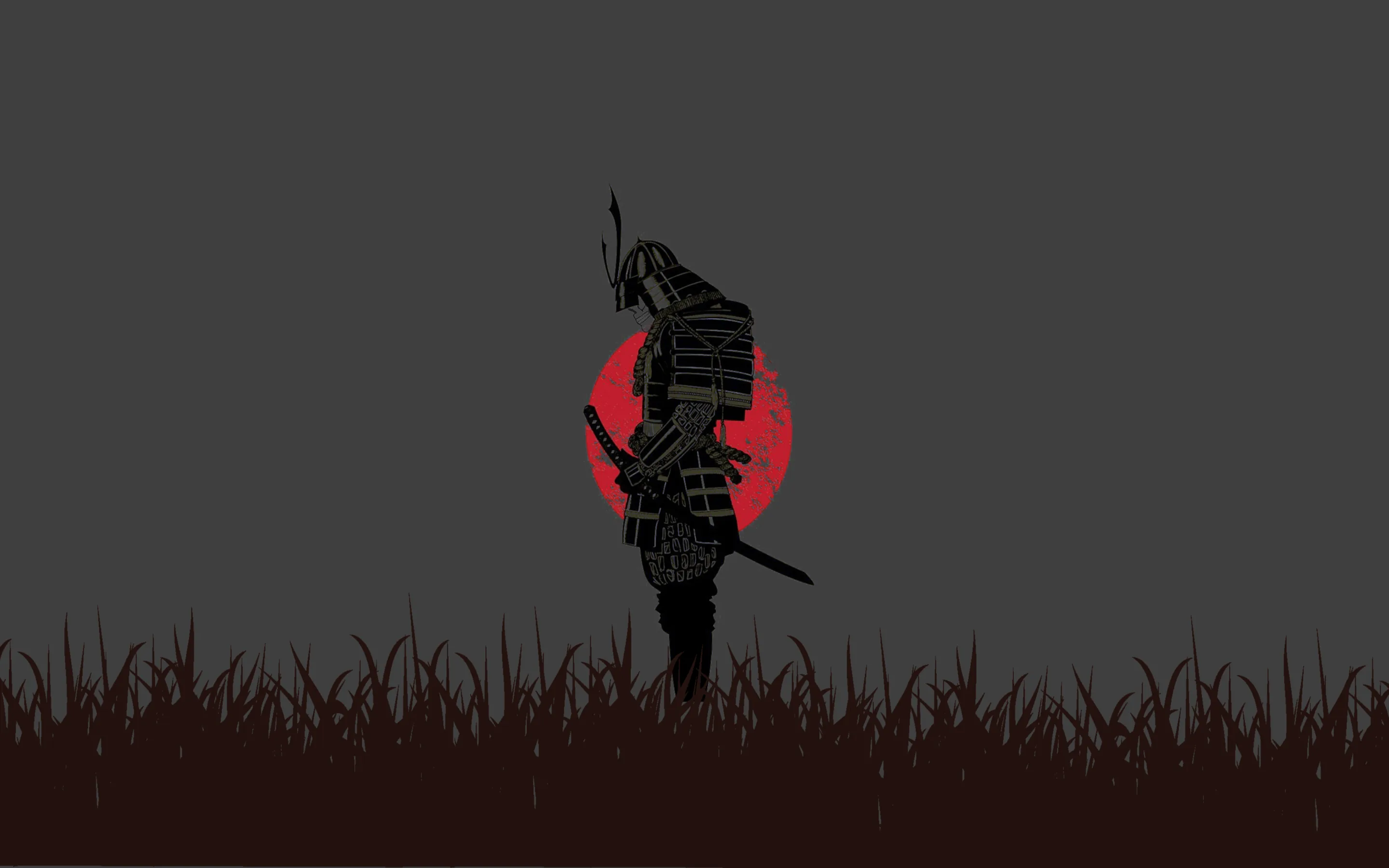 A samurai stands in tall grass with sword drawn, cut flat black against a dull red disc on a grey field with a wide empty sky.