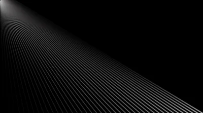 A field of thin parallel lines runs off to the upper right, catching light along one edge before the pattern drops away into pure black at the corners.