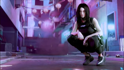 A dark-haired girl in black crouches at centre of a hazy backstreet, magenta light flooding in from the left and washing the ground pink.