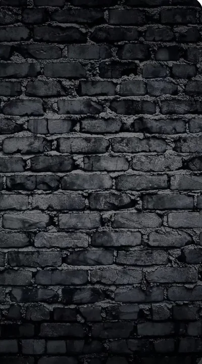 Old brick chipped at nearly every corner, a cool blue cast over the middle of the frame and heavy shadow closing in on both edges.