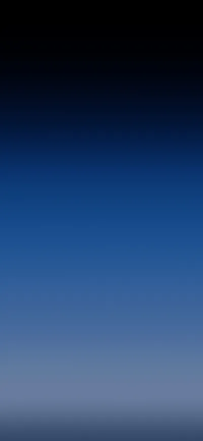 A vertical gradient running from near-black at the top through deep sea blue into a pale grey haze along the bottom edge.