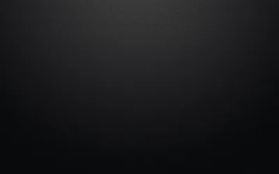 Dark grey along the top settles into black toward the bottom, an even matte surface with no texture and no hard edges.
