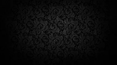 Worn damask curls spread across the centre in dim grey and dissolve into heavy black at every edge, the texture rough like aged fabric.